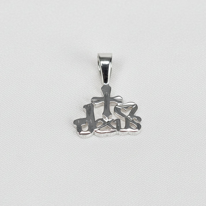 Silver pendant with intricate I Love Jesus design on a white cushion