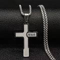 Silver cross pendant with 'JESUS' engraving on a black textured background