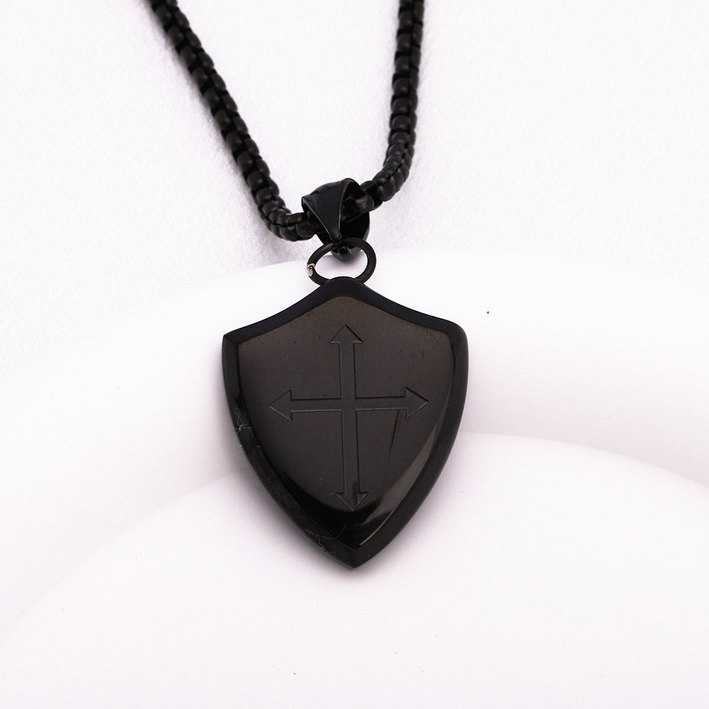 Black shield-shaped pendant on a white background