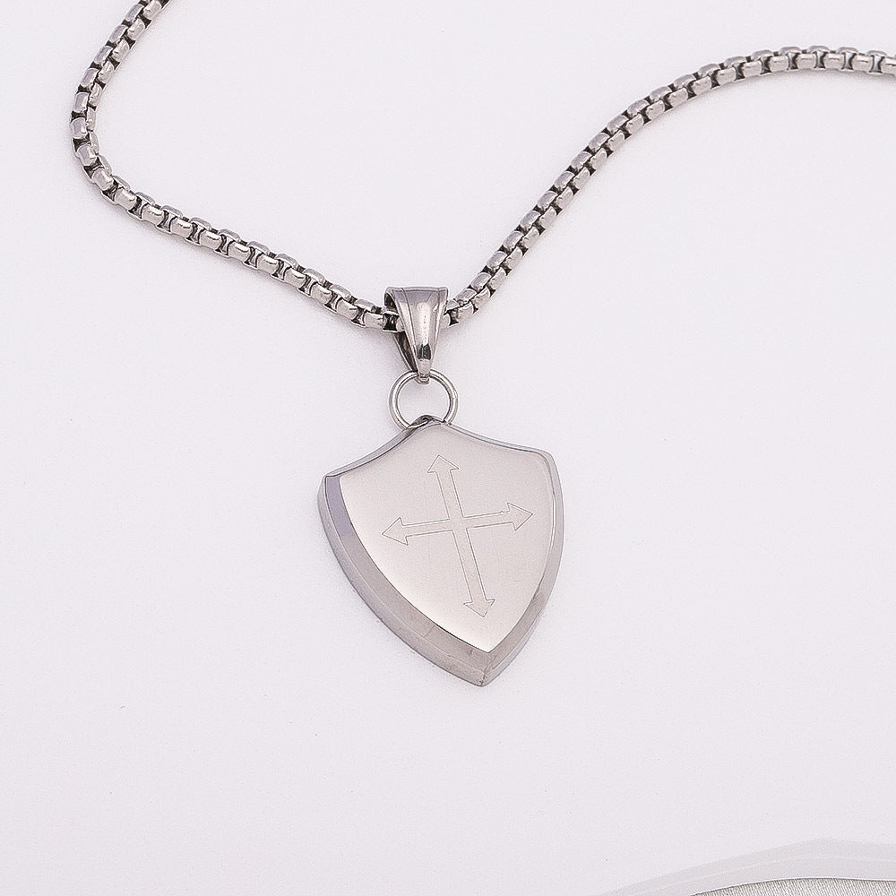 Silver necklace with a shield-shaped pendant on a white background