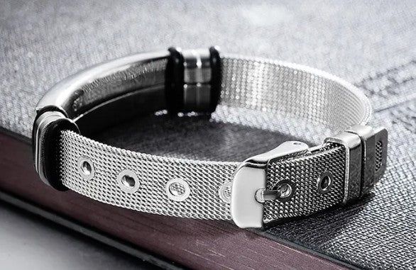 Silver bracelet a metallic finish on a textured surface