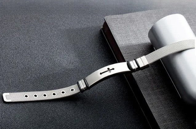 Metallic bracelet on a dark textured surface