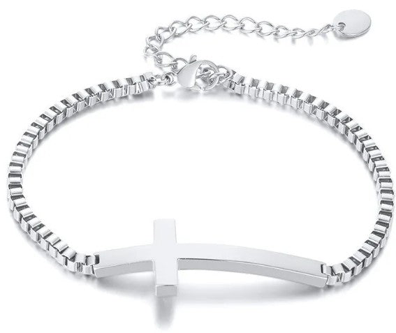 Silver bracelet with a cross charm on a white background