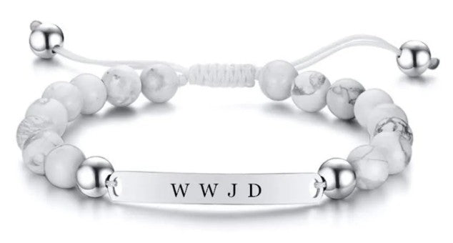 Bracelet with white beads and silver bar engraved with 'WWJD' on a white background