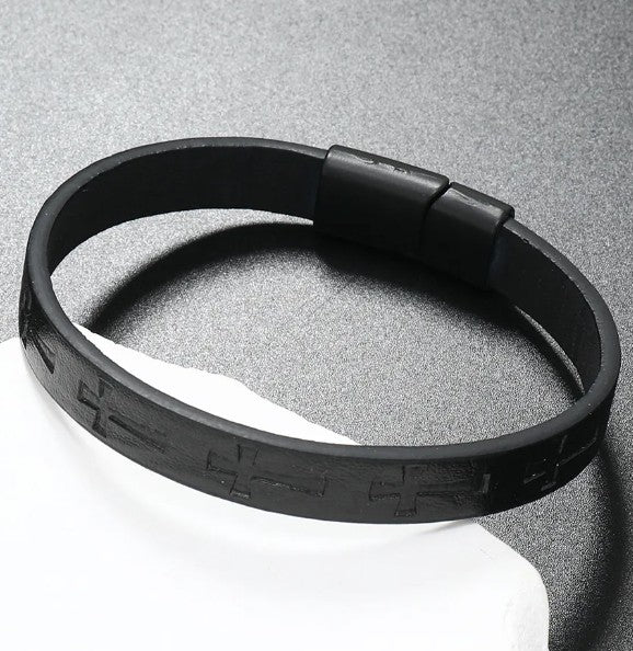Black silicone bracelet on a gray background