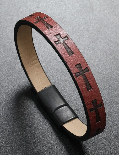 Burgundy leather bracelet with cross designs on a gray background