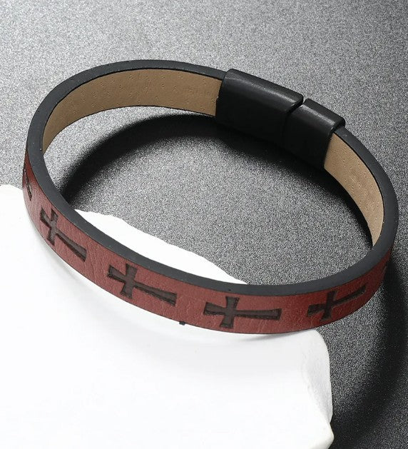 Bracelet with black and burgundy leather strap on a gray background