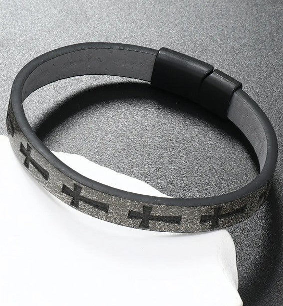 Gray leather bracelet with cross patterns on a gray background