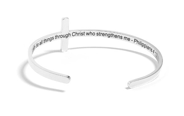 Silver bracelet with engraved text on a white background