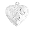 Silver heart-shaped locket with floral design on a white background
