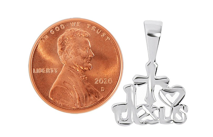 Silver 'I Love Jesus' pendant next to a penny for size comparison on a white background