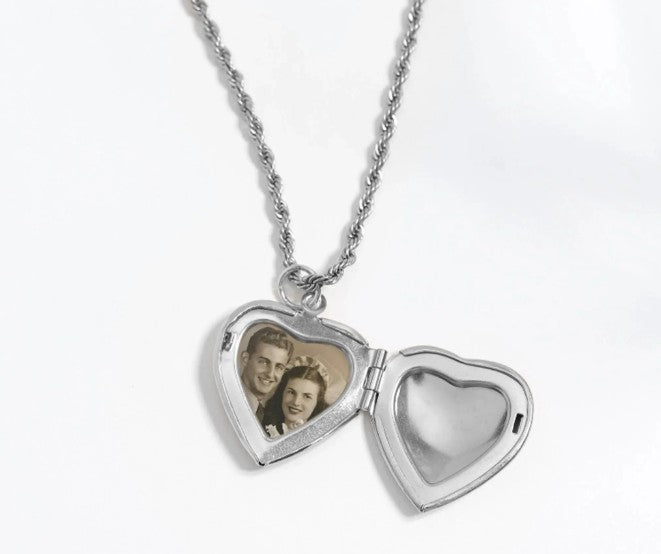 Heart-shaped locket with a chain on a white background