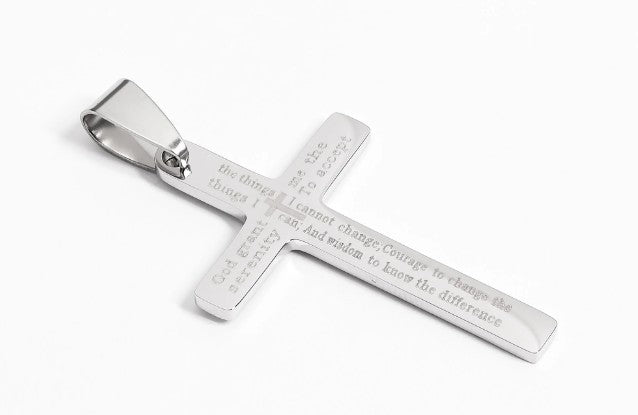 Silver cross pendant with engraved text on a white background