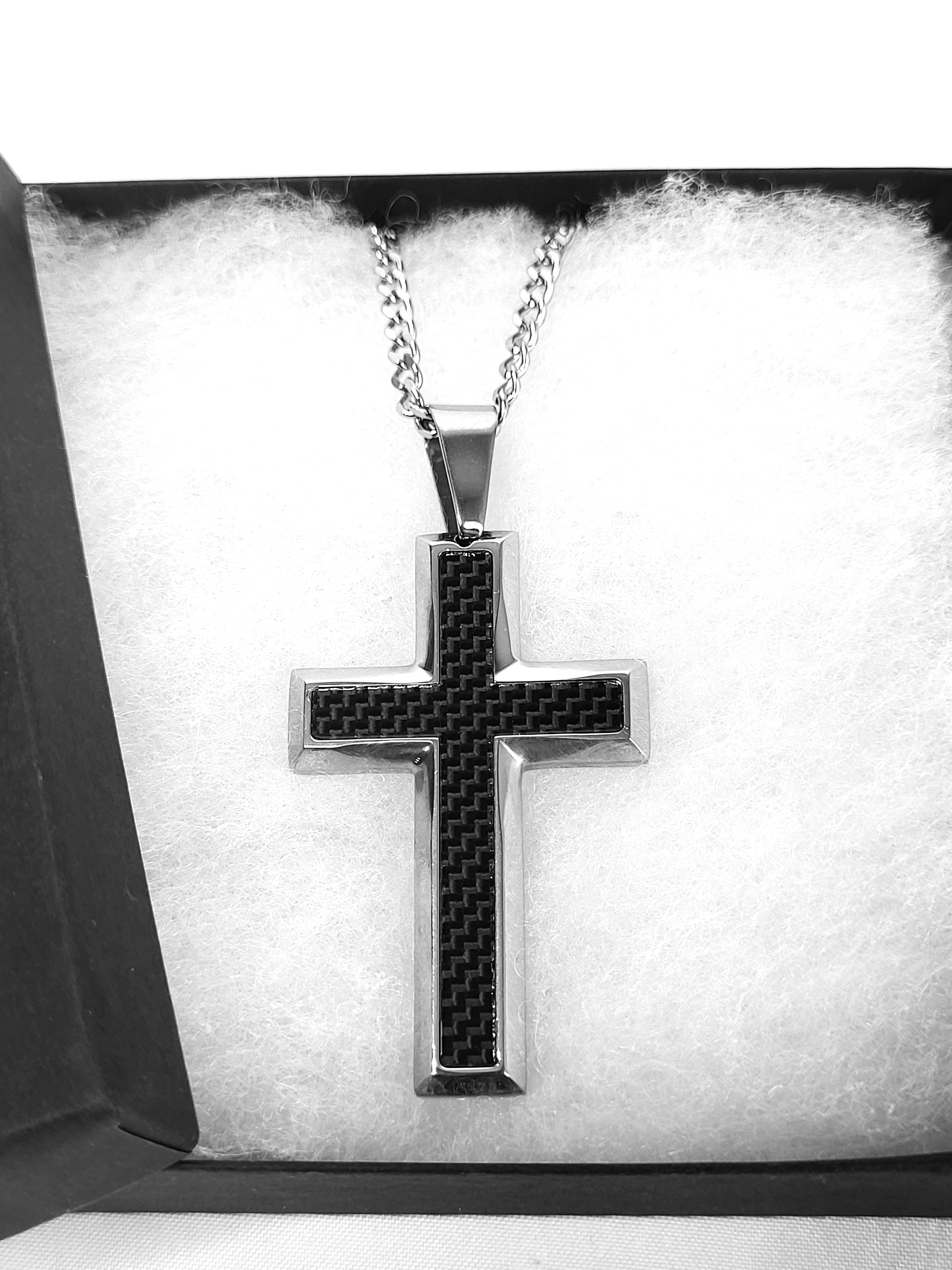 Cross pendant necklace on a white background