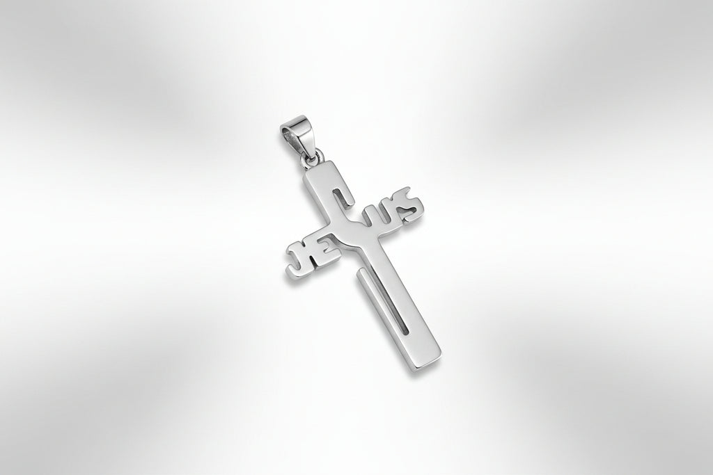 Silver cross pendant with 'Jesus' on a gray surface