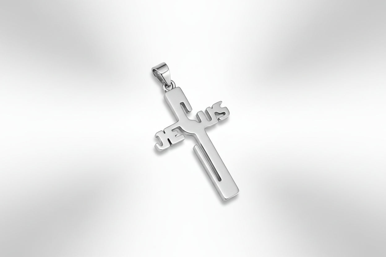 Silver cross pendant with 'Jesus' on a gray surface